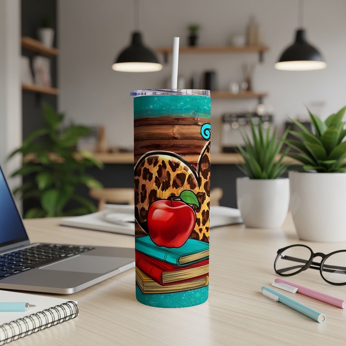 Tumbler with apple, books, leopard print, and turquoise wood design.