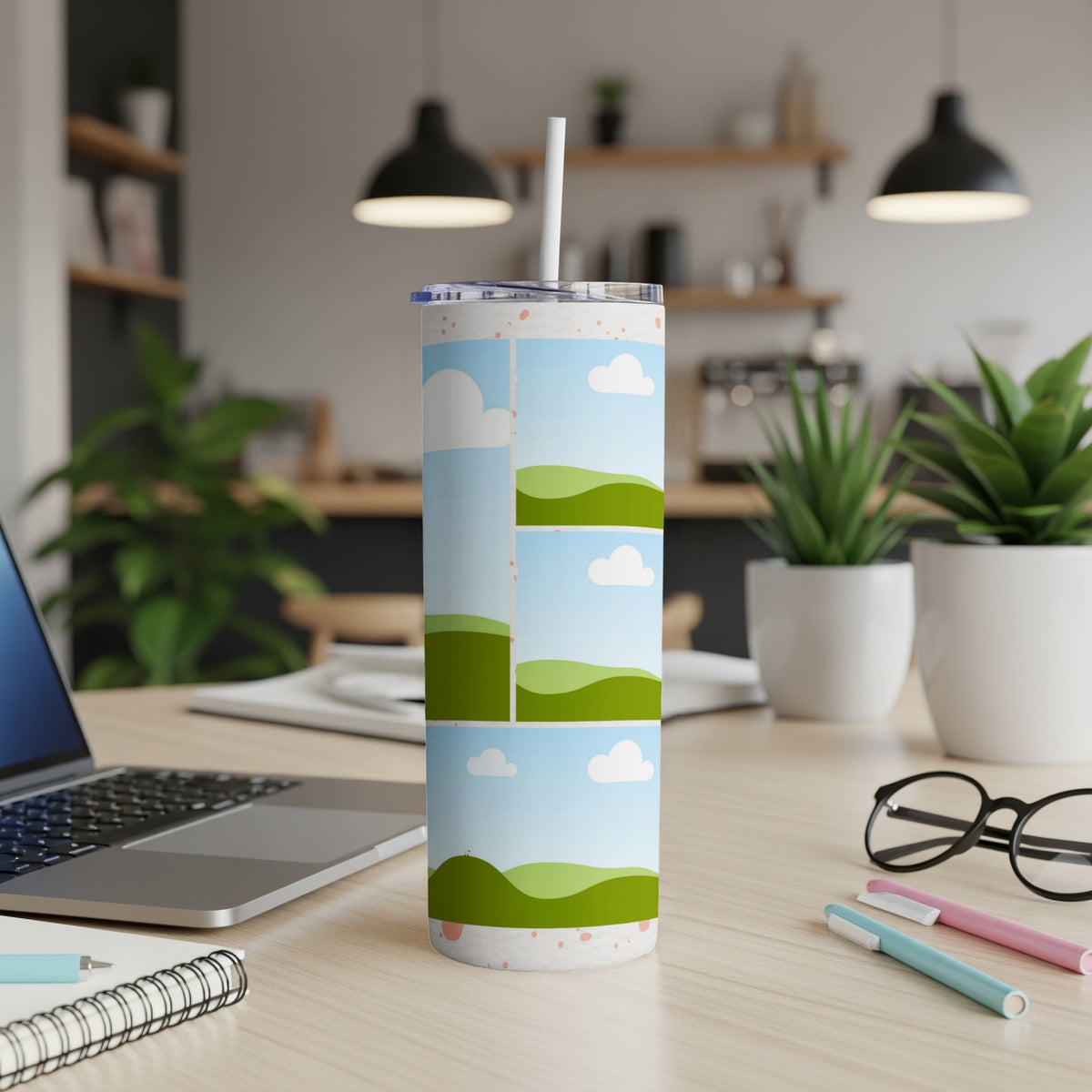 Tumbler with a stylized landscape design featuring rolling green hills and clouds.