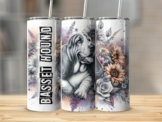Basset Hound illustration with sunflowers and floral accents on a white tumbler.