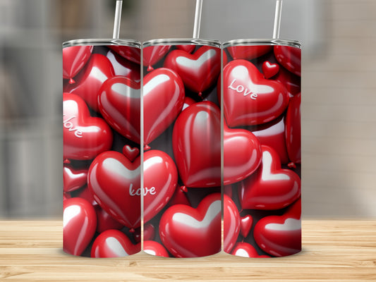 Three tumblers with a pattern of red hearts and the word "Love".
