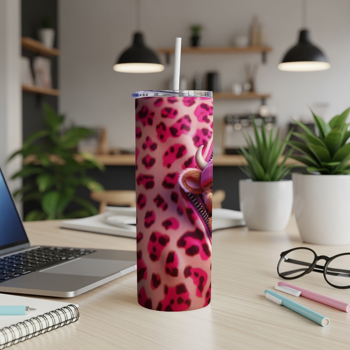 Tumbler with pink leopard print and a cartoon fox head zipper pull.