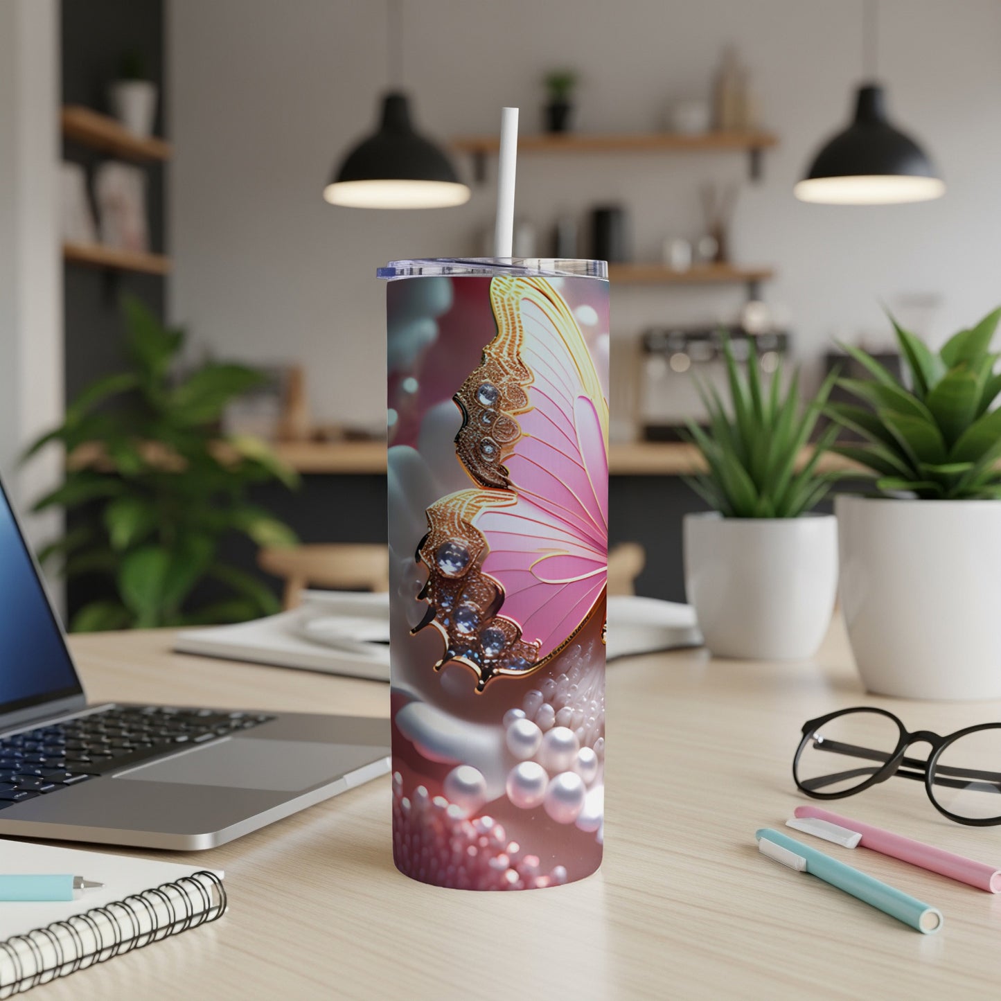 Pink butterfly on a pearl-embellished tumbler with straw.
