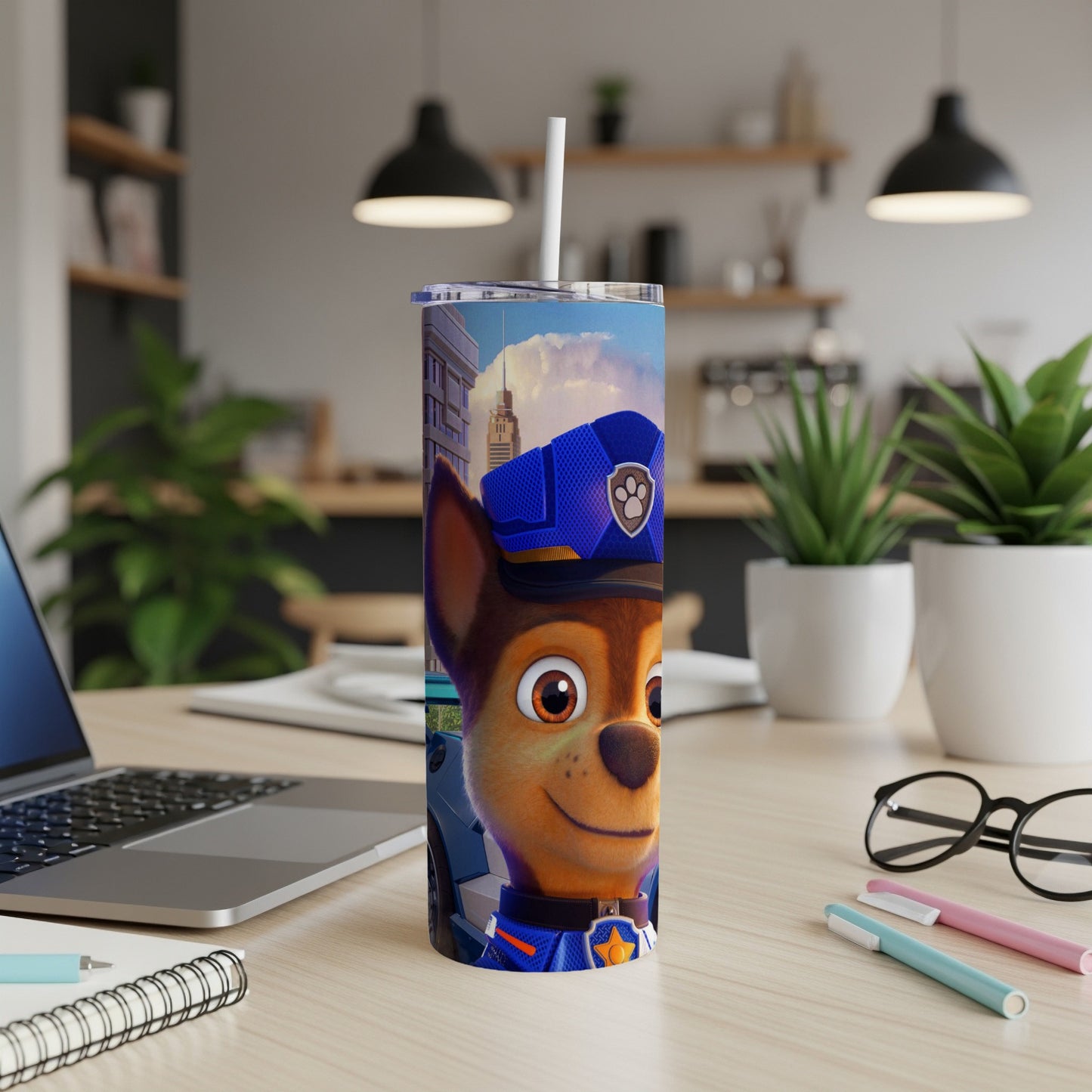 Paw Patrol Chase character on a blue tumbler with a straw.
