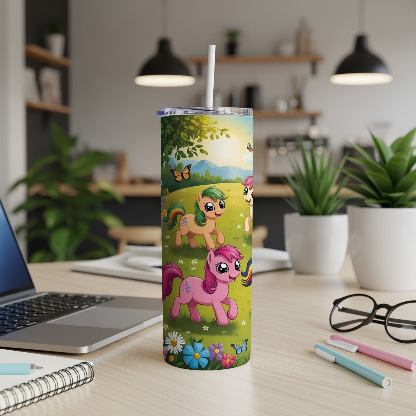 Cartoon ponies with butterflies and flowers on a tall tumbler.
