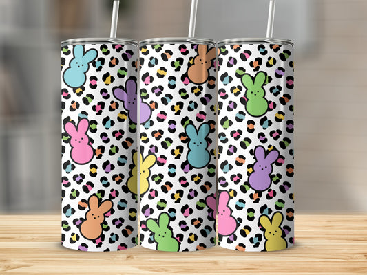 White tumbler with leopard print and colorful bunny silhouettes.