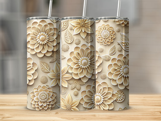 Three embossed floral tumblers with straws on a wooden surface.