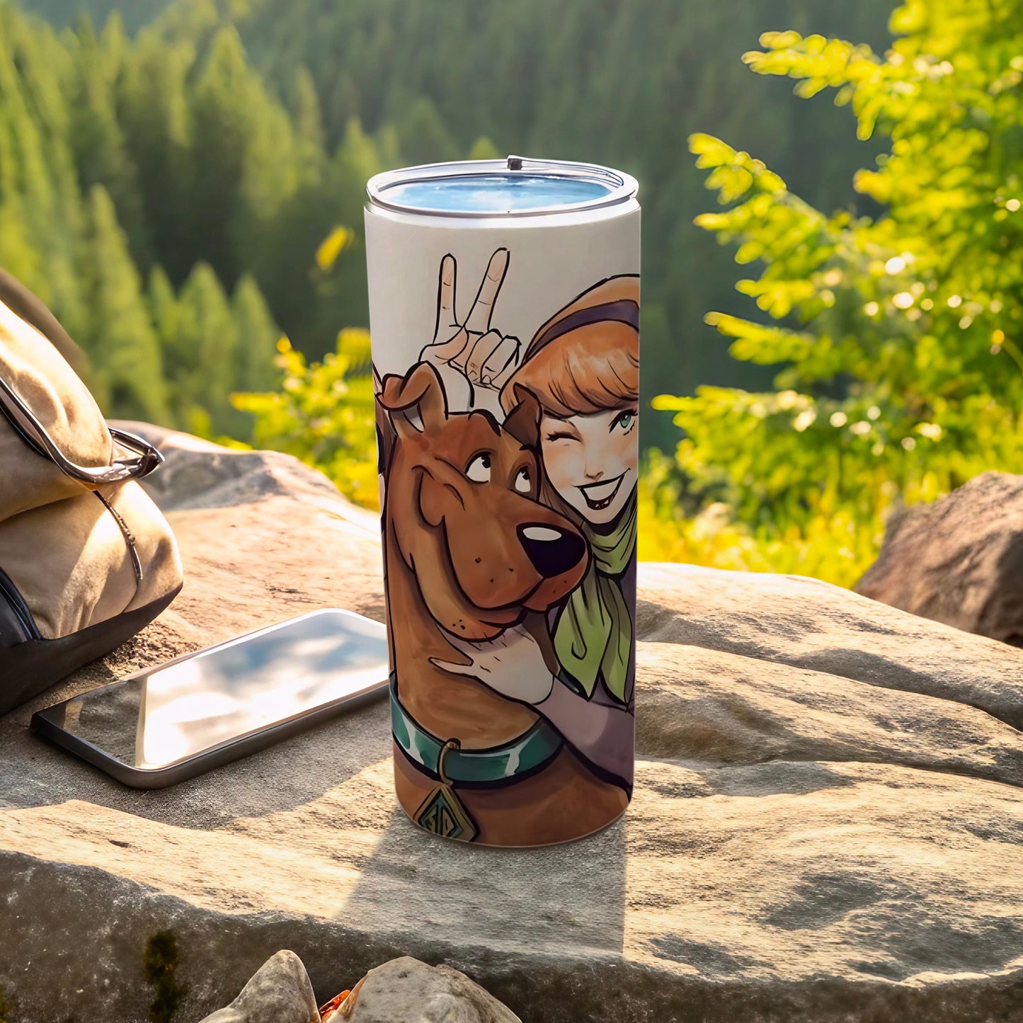 Scooby-Doo and Daphne artwork wraps around a silver tumbler.