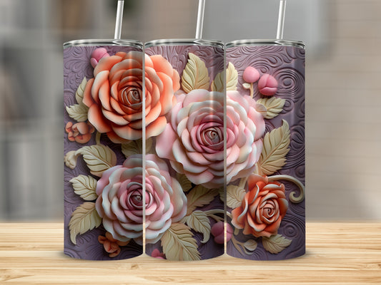 Three floral tumblers with embossed roses and leaves on a wooden surface.