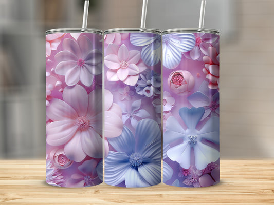 Three tall tumblers with pink and blue floral patterns on a wooden surface.