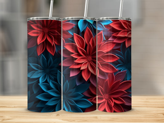 Three tumblers with red and blue floral designs stand on a wooden surface.