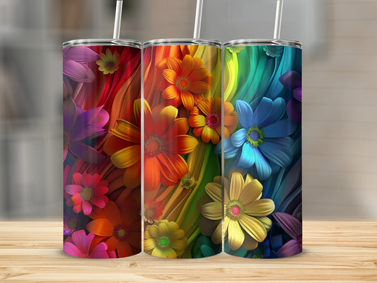 Three tumblers with vibrant floral rainbow designs on a wooden surface.