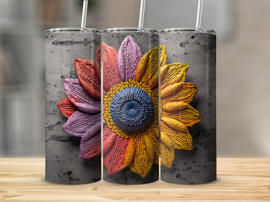 Three tumblers with a colorful, textured sunflower design on a concrete background.