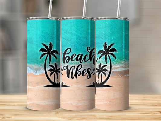 Beach vibes tumbler with palm trees and ocean waves on sandy background.