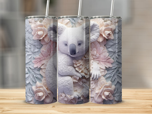 Three tumblers featuring a koala bear surrounded by pale pink and grey floral designs.