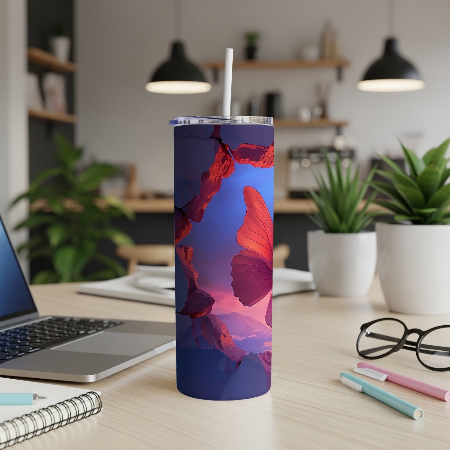 Purple tumbler with a large, red butterfly and red rock formations.