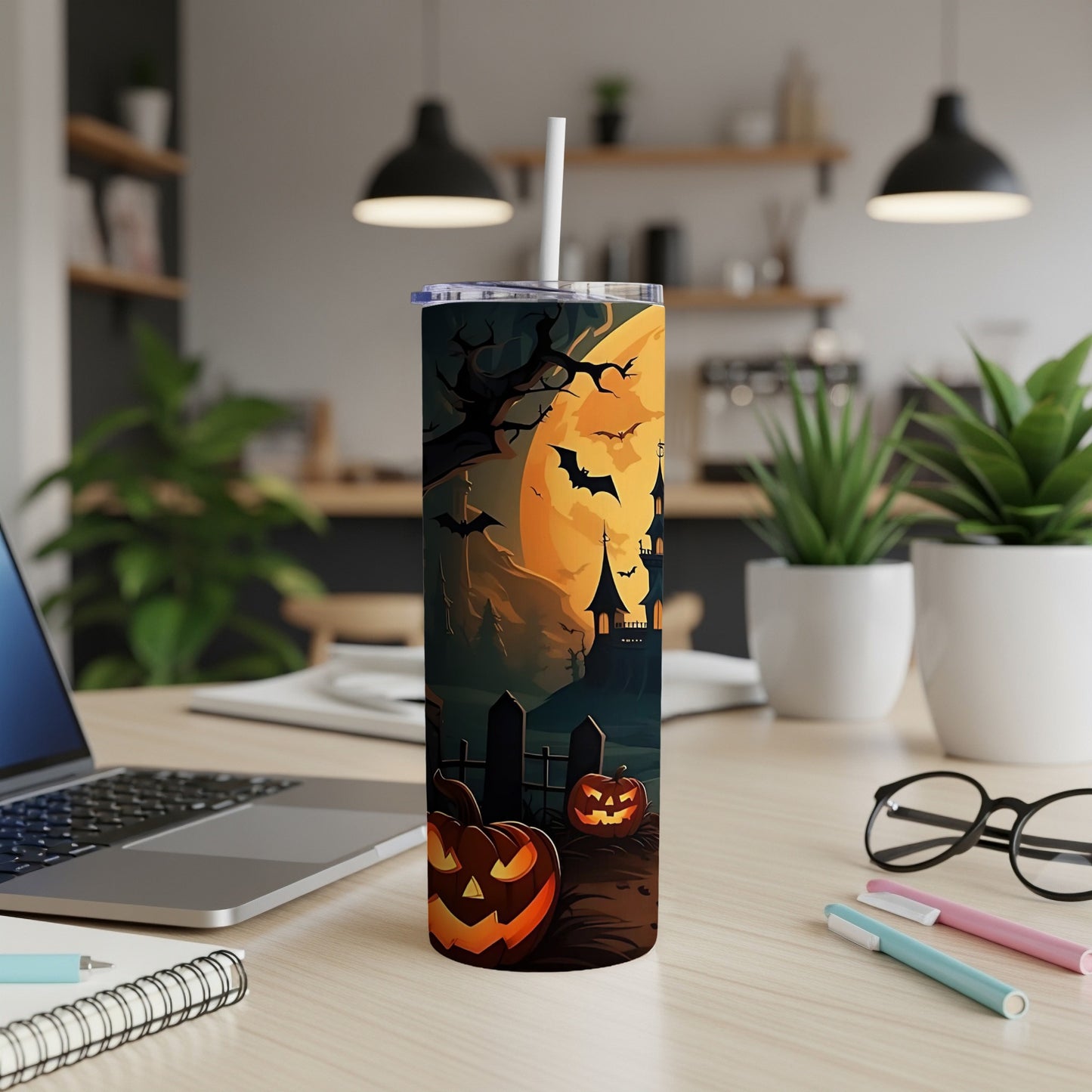 Tumbler with Halloween scene: haunted castle, full moon, bats, and jack-o'-lanterns.