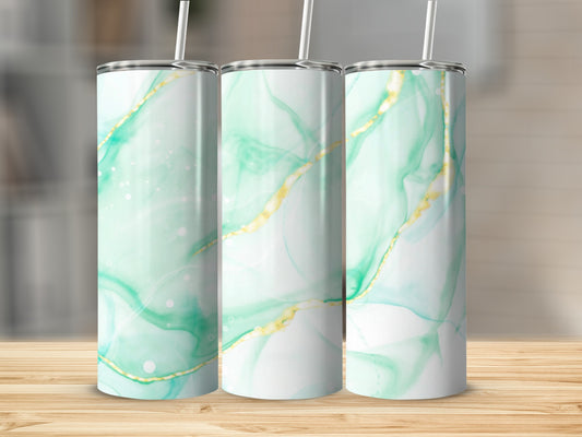 Three tumblers with green and gold abstract marble design and white straws.