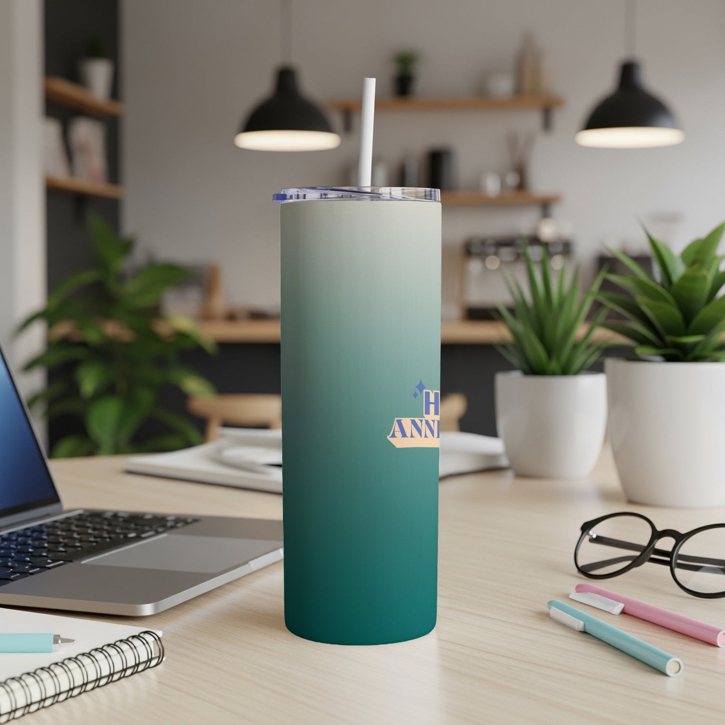 Gradient tumbler with "Happy Anniversary" text on a desk.