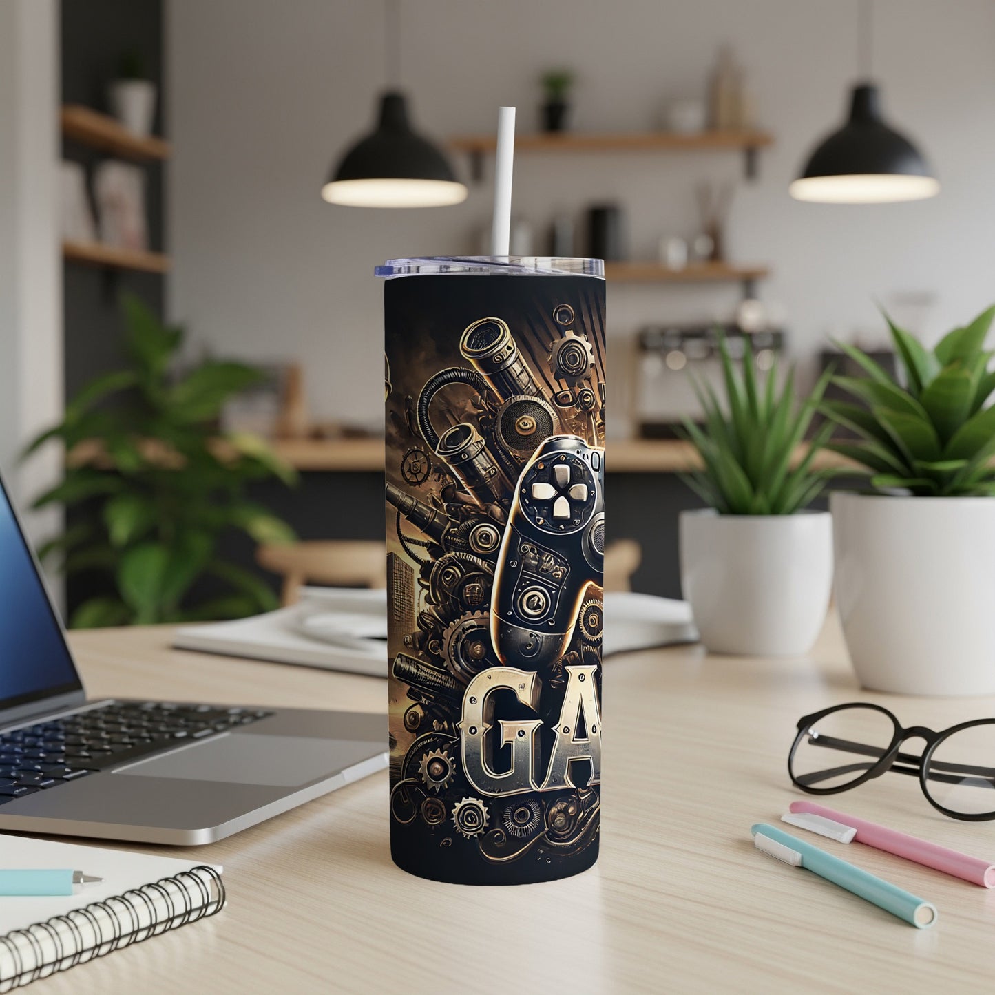 Gaming controller and gears design on a tumbler with a straw.