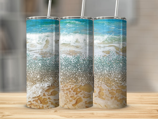 Three tumblers featuring a sparkling ocean wave and sandy beach design.