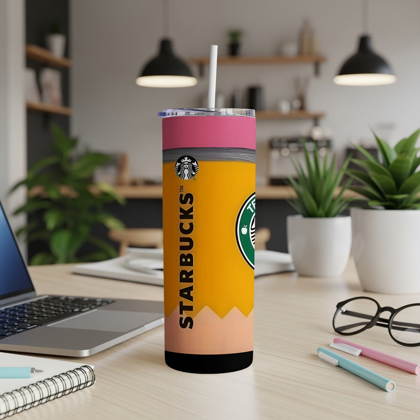 Starbucks tumbler resembling a pencil, with a white straw and pink lid.