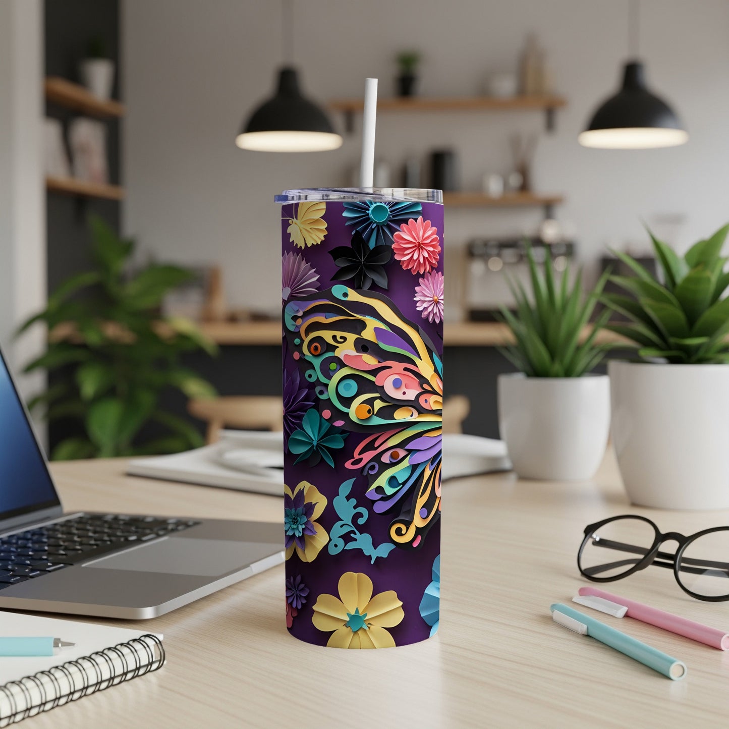 Purple tumbler with colorful butterfly and floral design, featuring a straw.