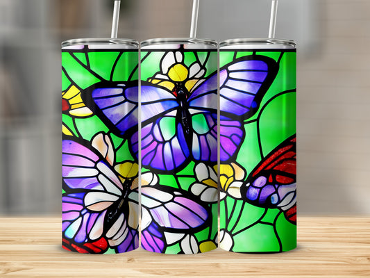 Three tumblers with stained glass butterfly designs.