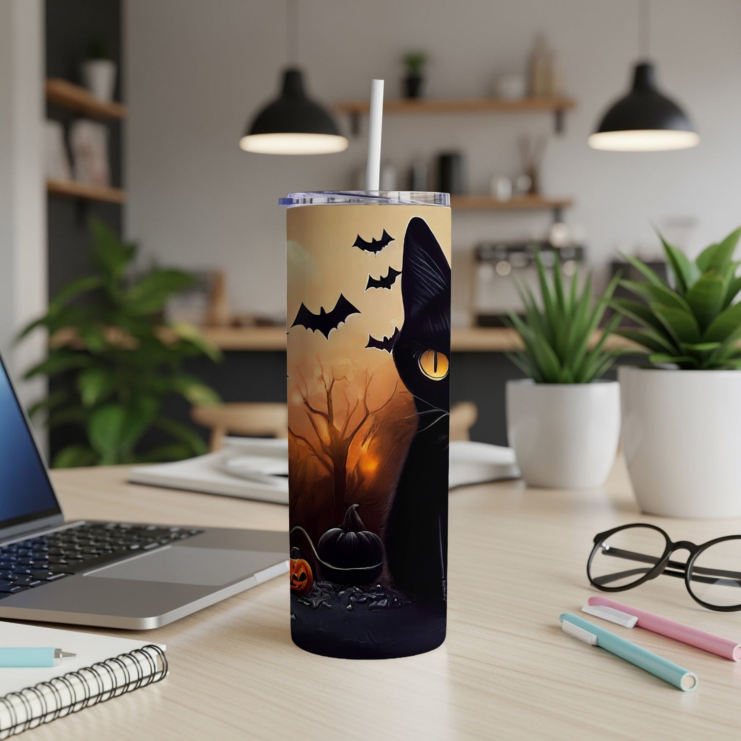 Black cat Halloween tumbler with bats, pumpkins, and a spooky forest scene.
