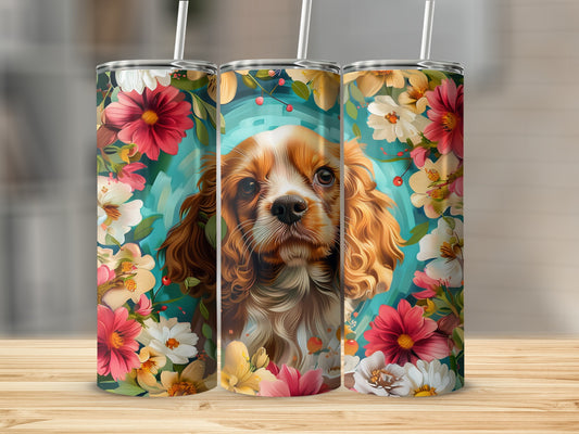 Three tumblers featuring a Cavalier King Charles Spaniel surrounded by colorful flowers.