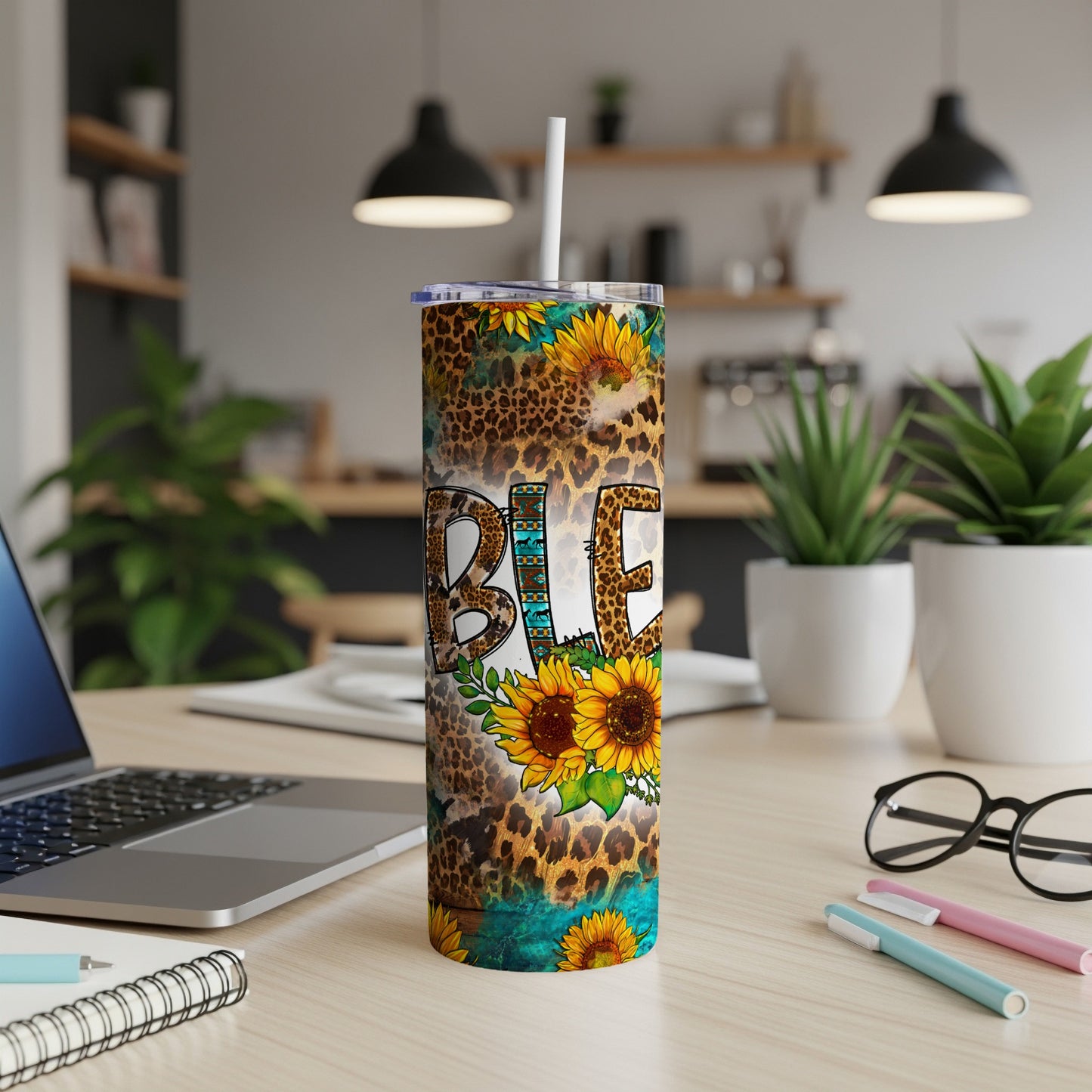 Tumbler with "Blessed" in leopard print, sunflowers, and turquoise accents.