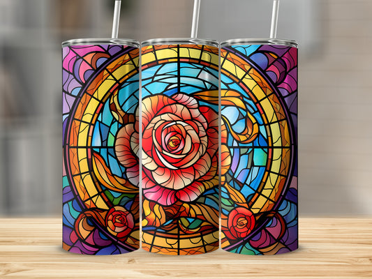 Three tumblers with stained glass rose design on wooden surface.