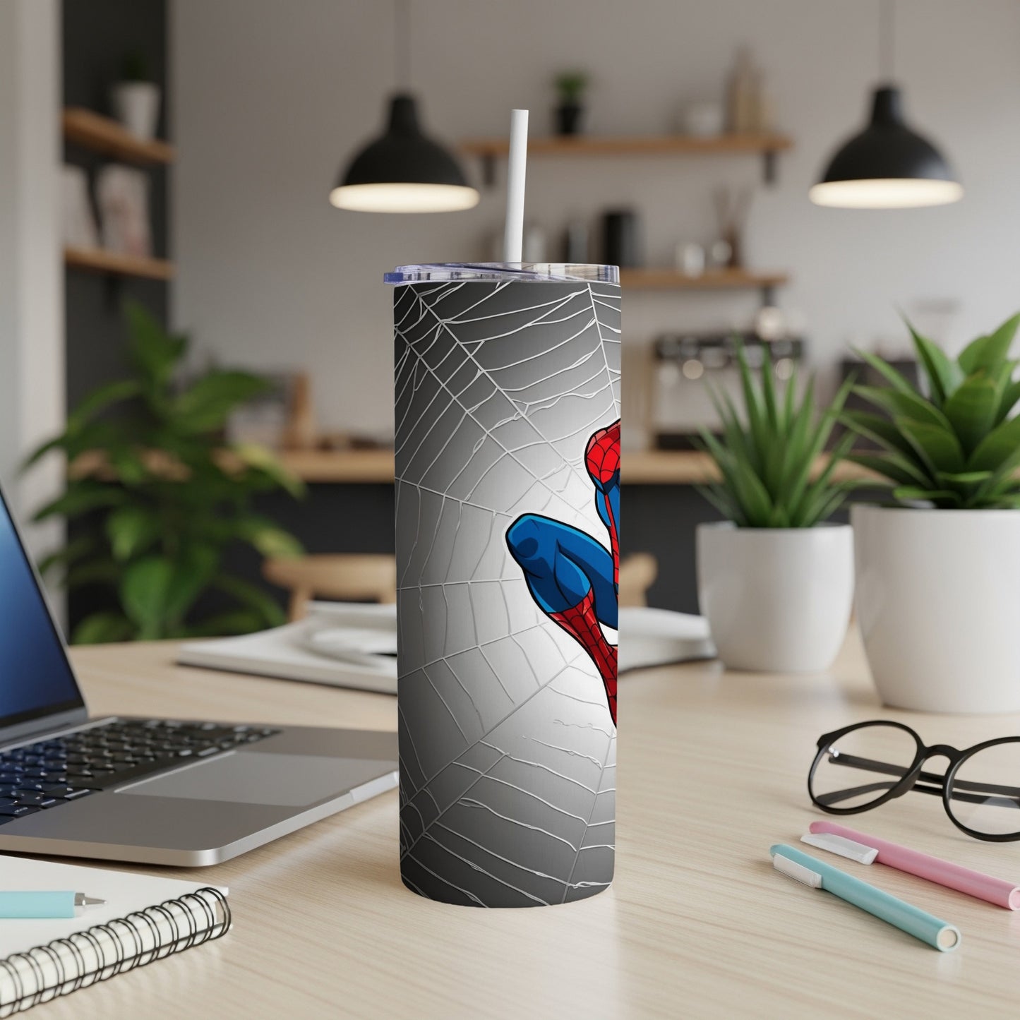 Spider-Man on a white skinny tumbler with a spiderweb design.