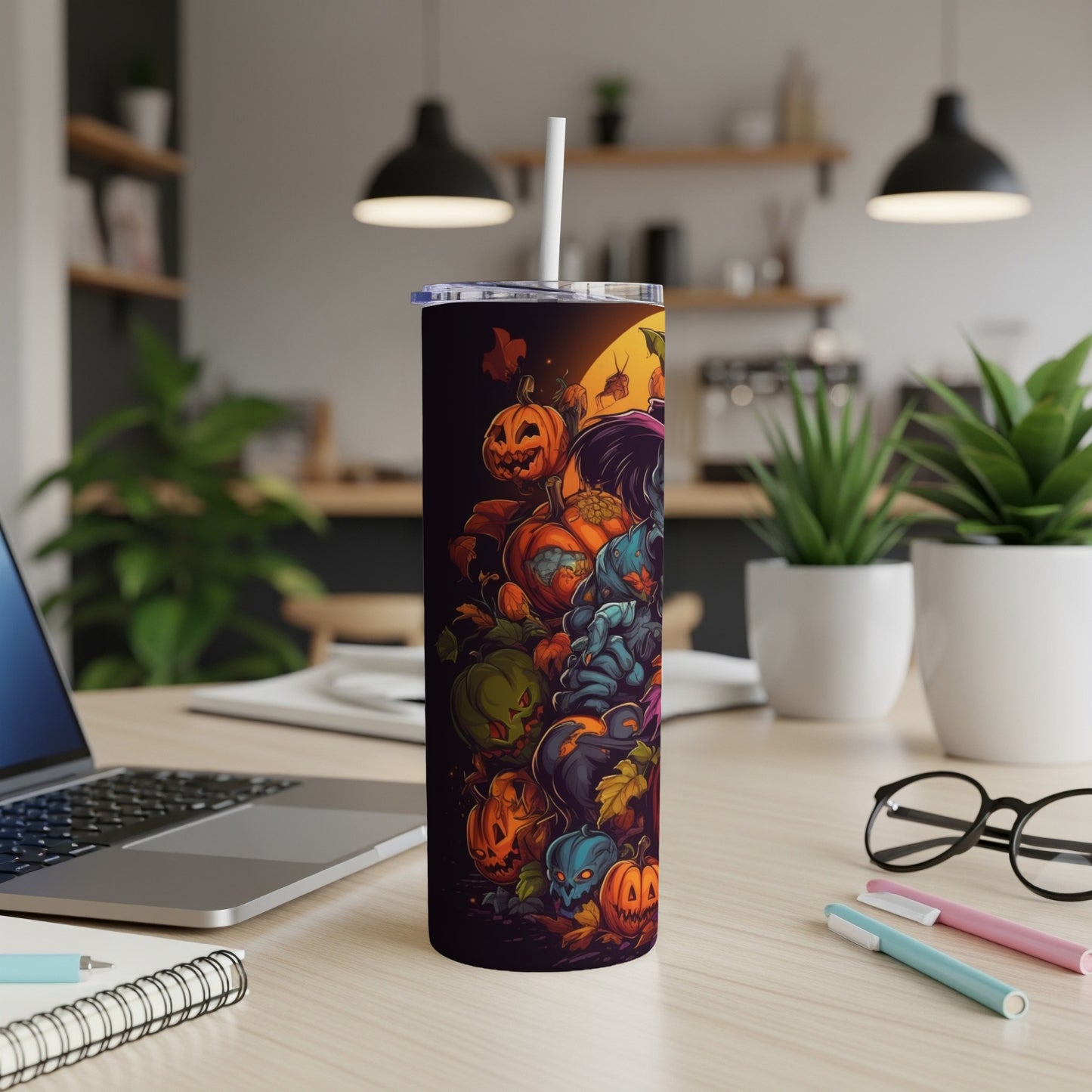 Tumbler with a Halloween-themed design featuring pumpkins and spooky creatures.