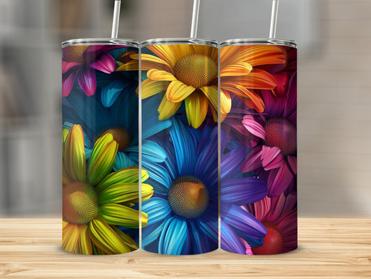 Three tumblers with vibrant floral patterns in rainbow colors.