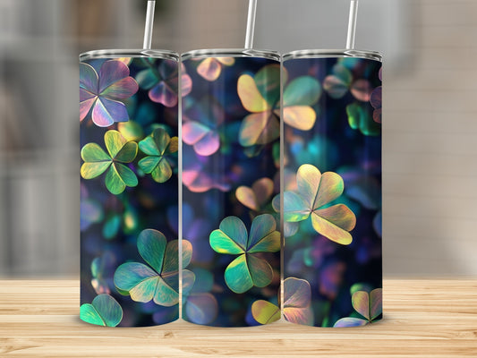 Three iridescent shamrocks on tumblers with a blurred background.