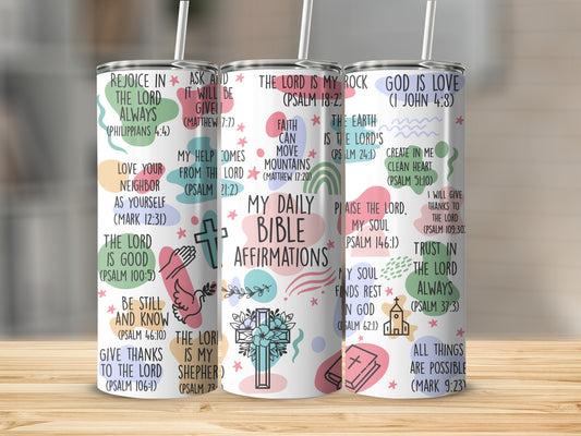 Daily affirmations with Bible verses and religious icons on a tumbler.