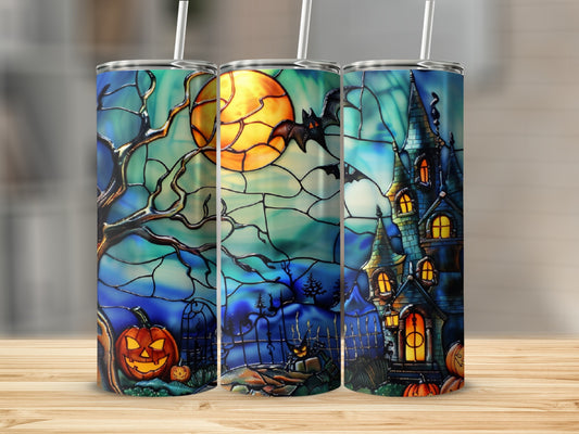 Stained glass tumbler with Halloween scene: haunted house, jack-o'-lanterns, moon, and bat.