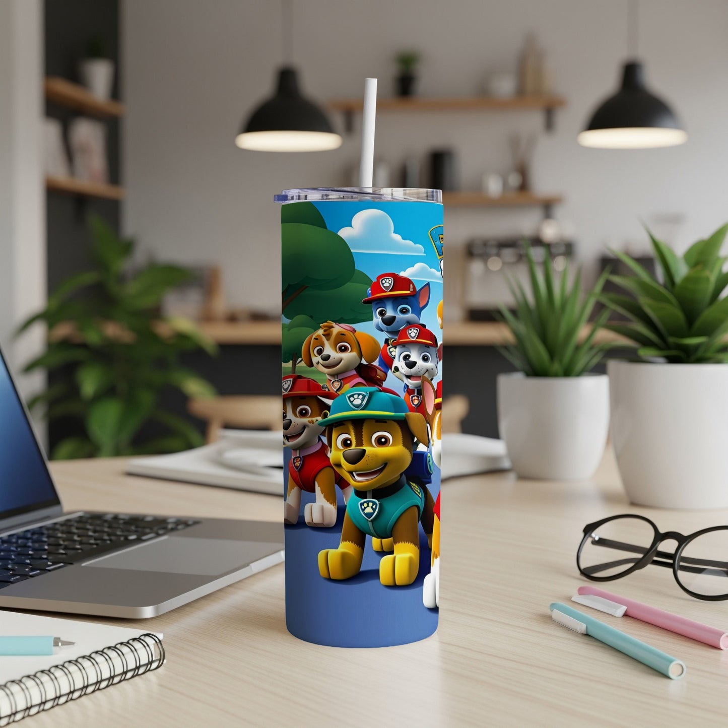 Paw Patrol characters on a blue tumbler with a white straw.