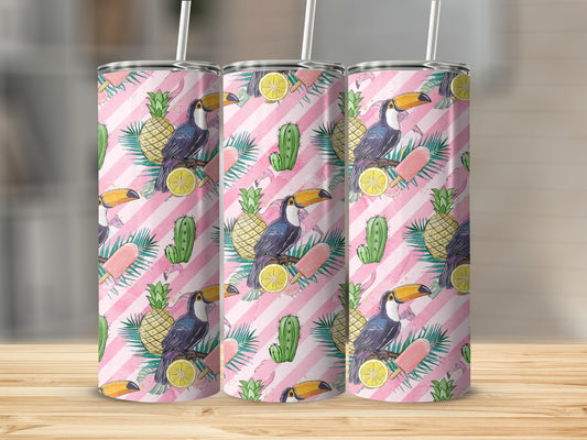 Pink striped tumbler with toucans, pineapples, lemons, cacti, and flamingos.