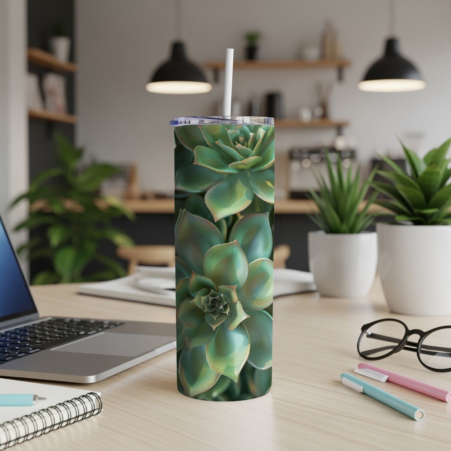 Green succulent plant close-up on a white tumbler with a straw.