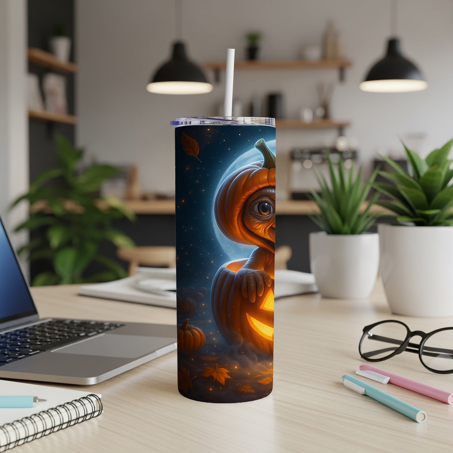 Tumbler with a glowing jack-o'-lantern and moon Halloween design.