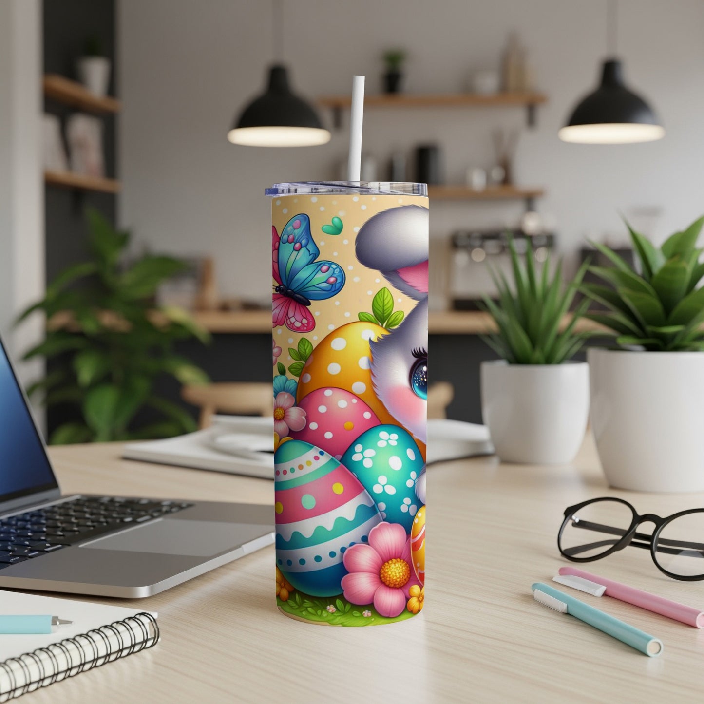 Easter bunny with colorful eggs and butterflies on a tumbler.