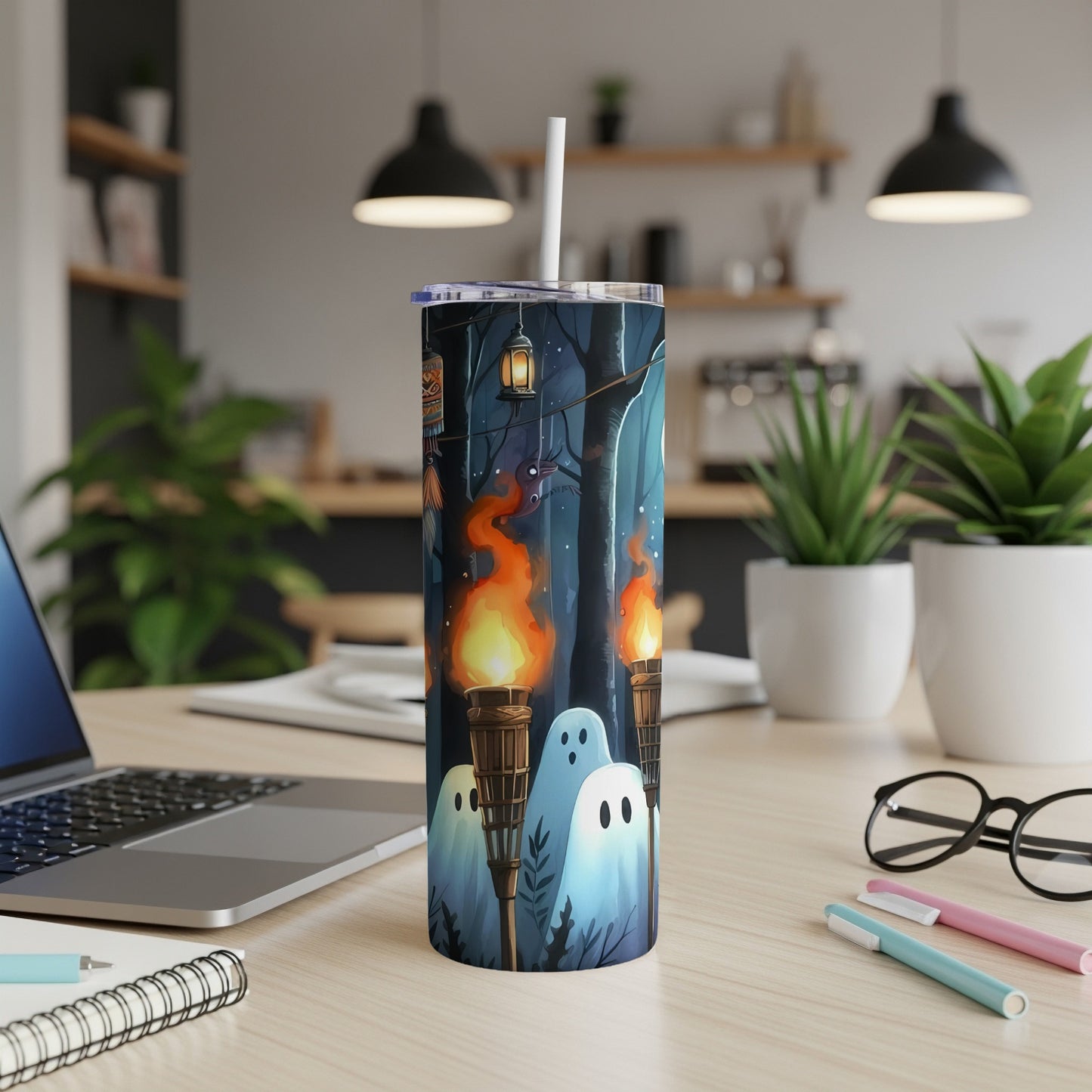 Tumbler with Halloween ghosts, torches, and lanterns in a dark forest scene.