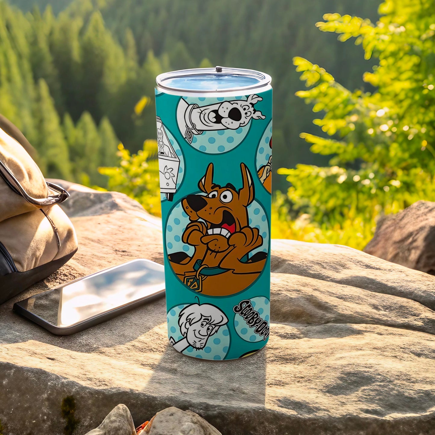 Scooby-Doo cartoon pattern on a blue tumbler with a forest background.