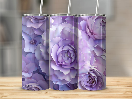 Three purple floral tumblers with straws on a wooden surface.