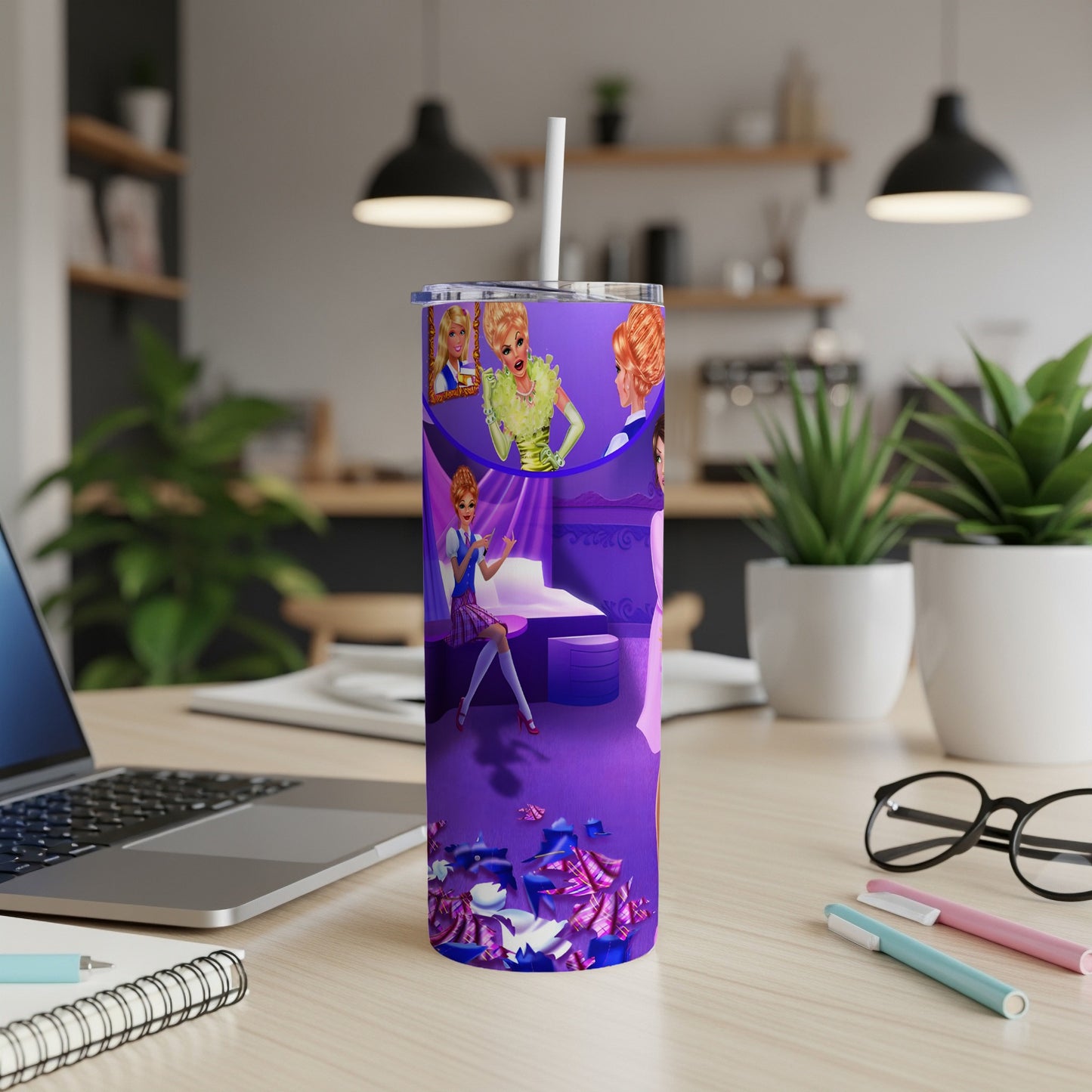 Purple tumbler with cartoon queens and scattered paper on a desk.