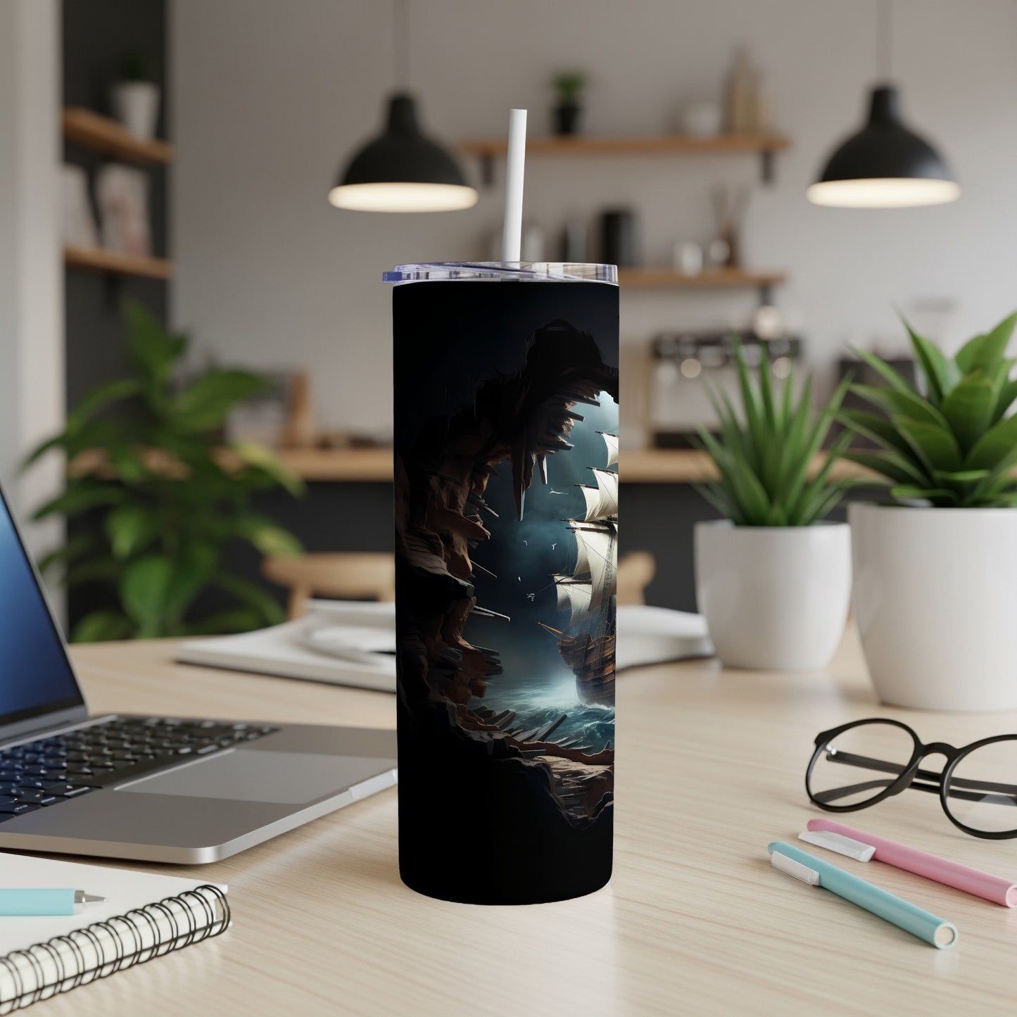 Sailboat emerging from a cave entrance depicted on a black tumbler.