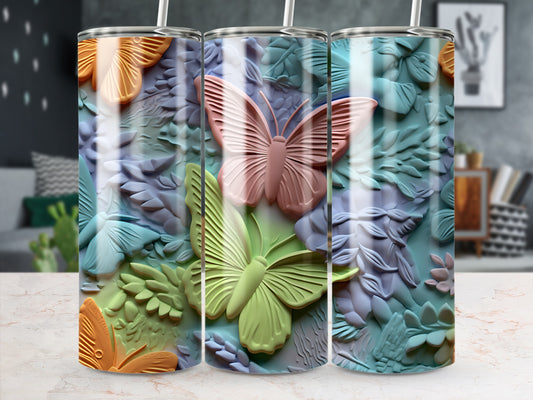 Three tumblers with embossed butterflies and floral designs.