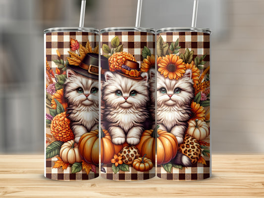 Three tumblers featuring a fluffy kitten wearing a hat surrounded by pumpkins and fall leaves.