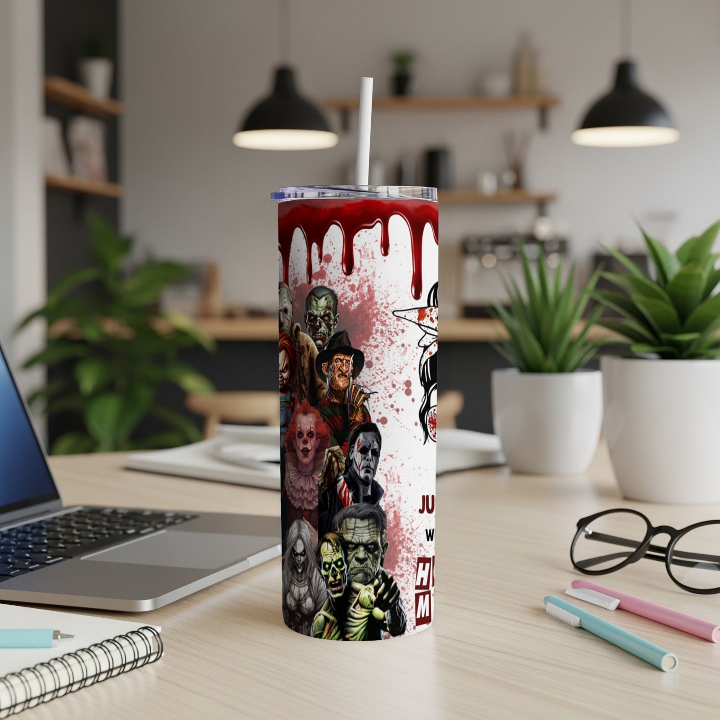 Bloody tumbler with iconic horror characters and black script text.